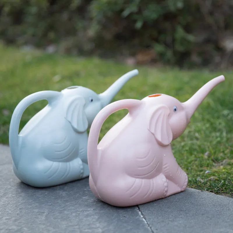 Pink elephant-shaped children's watering can with a long nozzle and baby bottle handle.