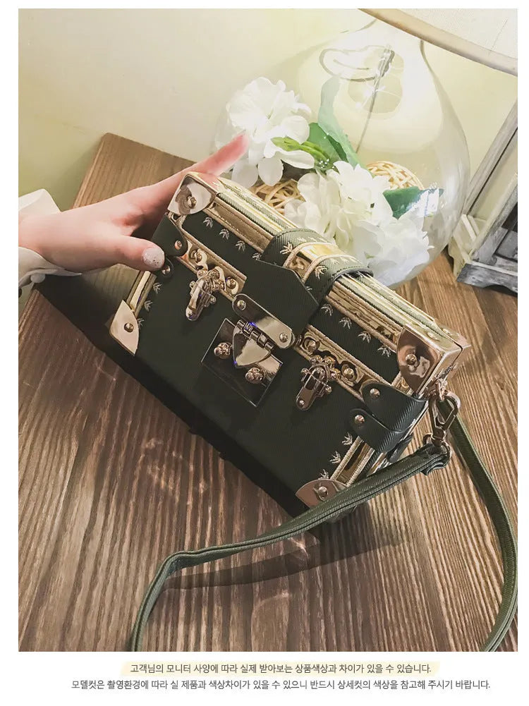 Women's black PU leather hard flap shoulder bag with decorative rivets and hasp closure