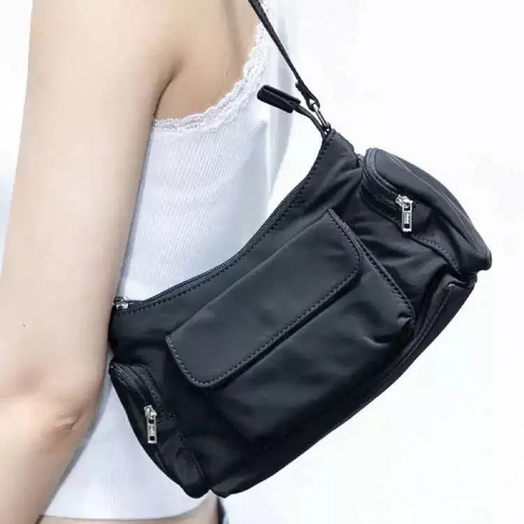 Black lightweight women's shoulder bag with double pockets and side line detailing