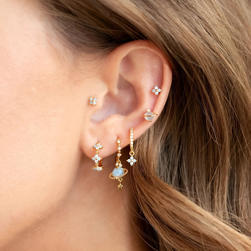 Flower shaped ear studs with blue zircon mosaic in gold and silver colour options