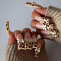 Leopard print butterfly nail art decoration pieces in plastic material with WM296 colour