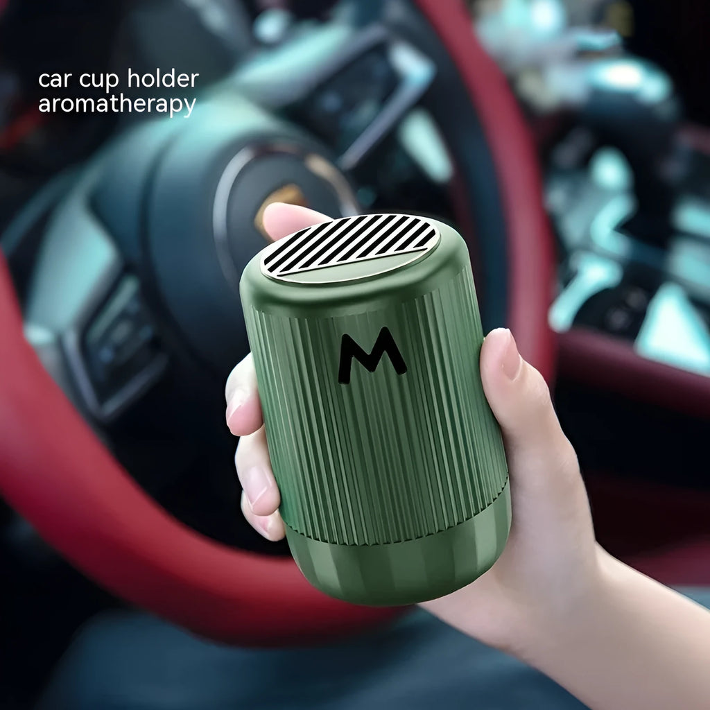 Solid car aromatherapy decoration cup in choice of four scents, dimensions 10 by 6 centimetres.