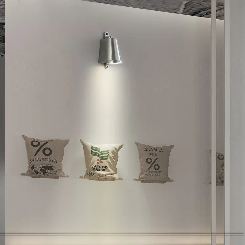Industrial style cast aluminium outdoor wall lamp with horseshoe shape and sand finish.