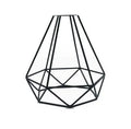 Minimalist hollow iron table lamp in red wine glass style on a wooden desk.