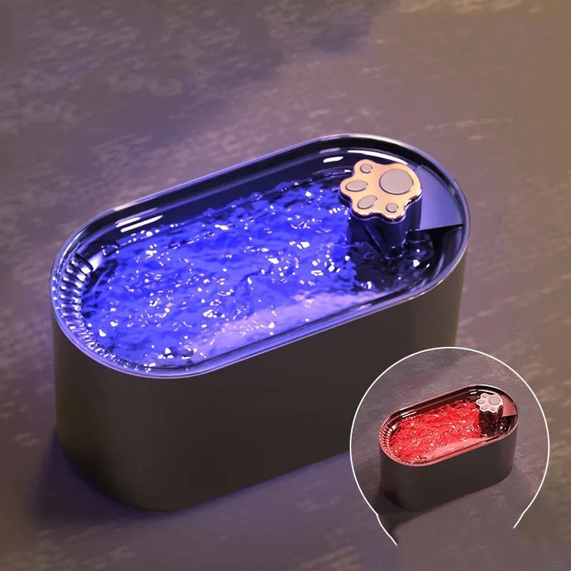 Berlin Blue 3-litre automatic pet water fountain with filter and LED light on a wooden floor.