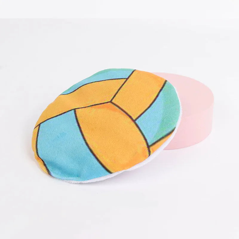 Soft plush cat flying disc toy with sports ball pattern, containing catnip and crinkle material.