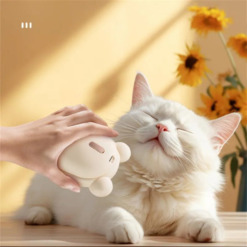 Pink and yellow rechargeable pet grooming brush with spray bottle attachment and removable silicone comb head