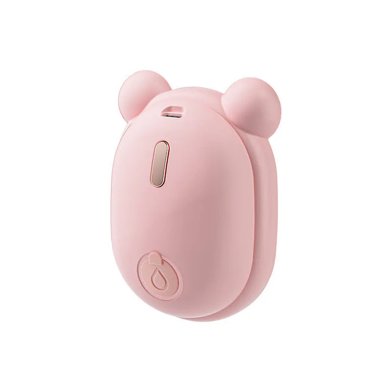 Pink and yellow rechargeable pet grooming brush with spray bottle attachment and removable silicone comb head