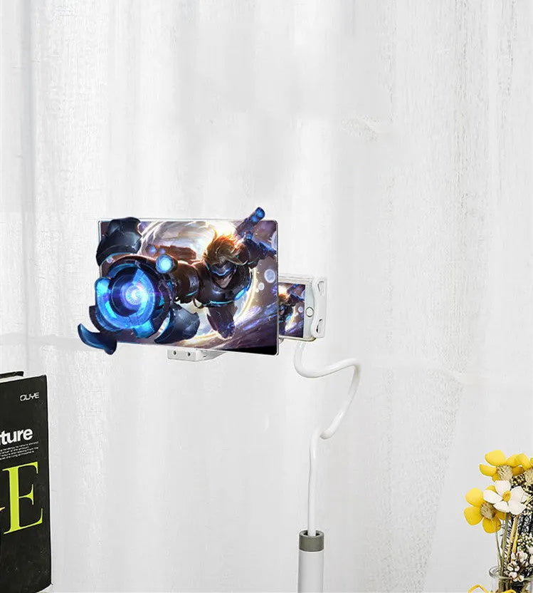 Black 12-inch mobile phone screen amplifier with adjustable bracket on a table.