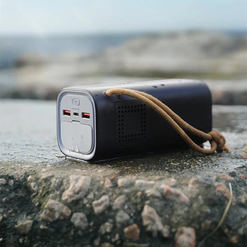 Black portable power bank with 20000mAh capacity and solar panel for emergency outdoor charging.