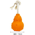 A long, brown, natural rubber stuffable dog toy for small medium breeds, shown with a treat inside.