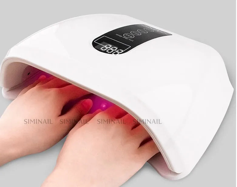 96W white LED nail dryer with 48 bulbs, infrared sensor, and removable tray, placed on a flat surface