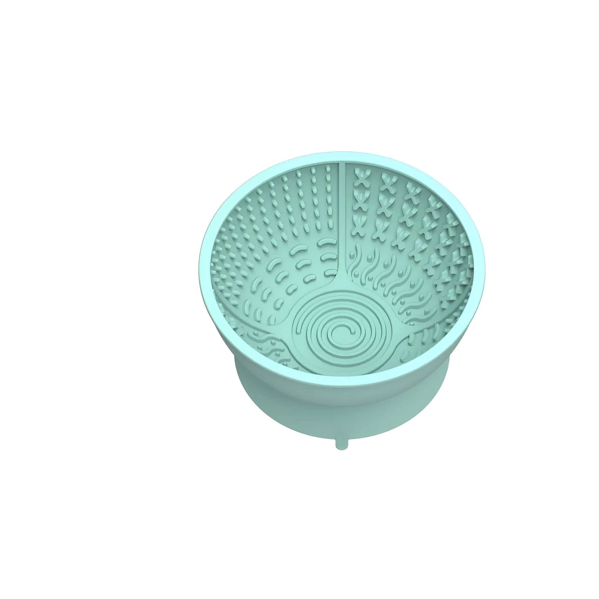 Cyan silicone dog bowl with slow feeder ridges and suction cup base on a table.
