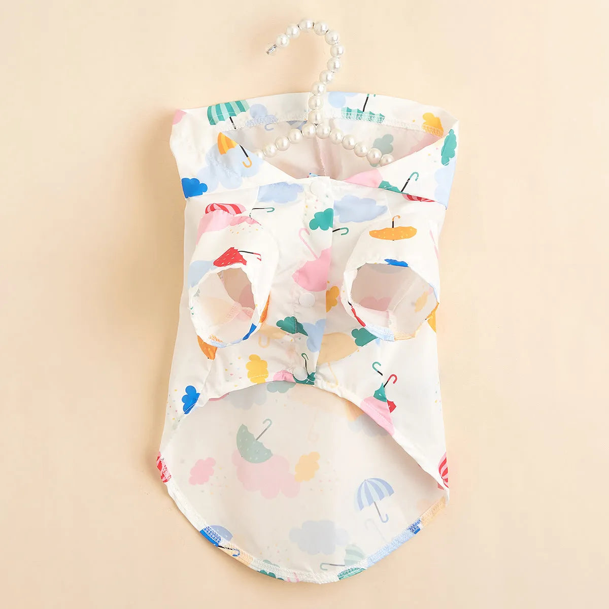 Colourful cartoon umbrella pattern dog and cat raincoat made from polyester fabric.