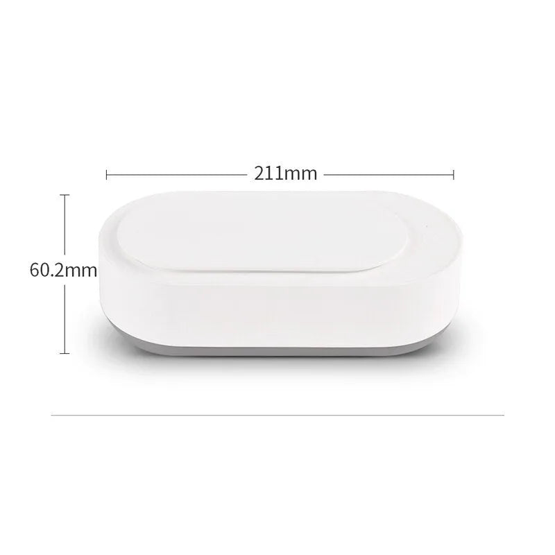White portable ultrasonic cleaning machine with a stainless steel tank for jewellery and glasses.