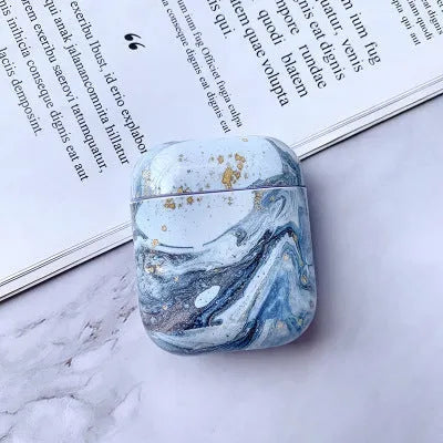 White marble protective case for Apple AirPods charging box showing hard PC construction