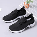 Women's black mesh sneaker with lace-up front and round toe on a non-slip PVC sole.