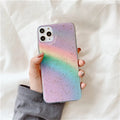 Rainbow gradient iPhone case with striped design on a phone