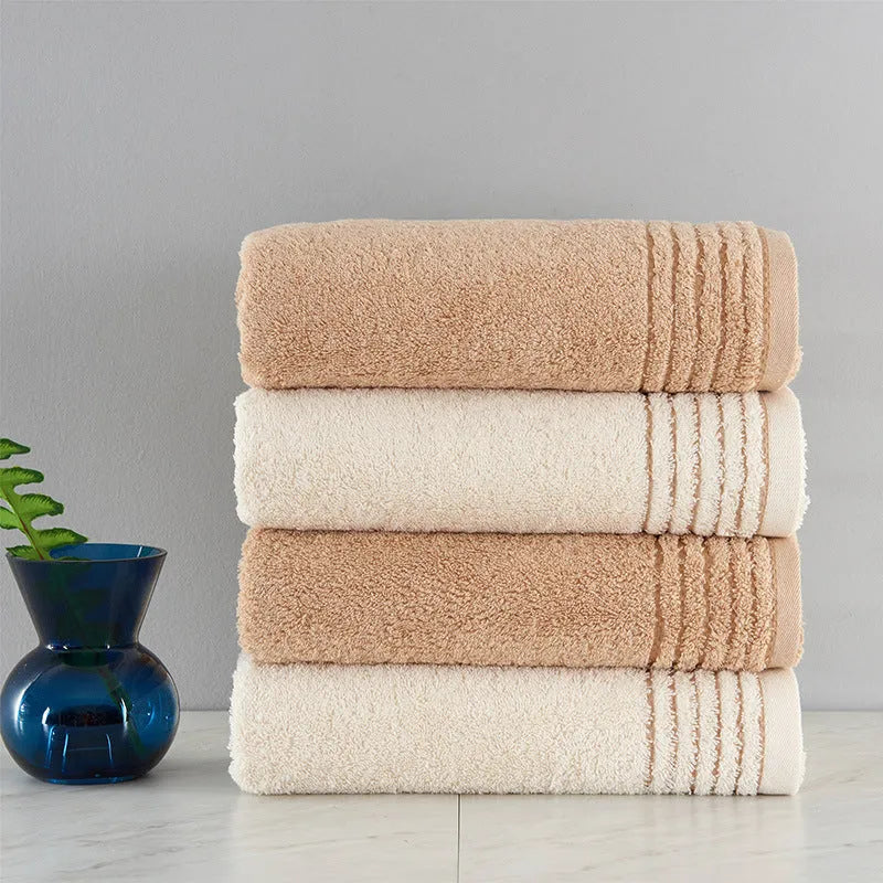 Cotton towel set in beige and brown with 395 GSM weight including bath towel, hand towel, and face cloth