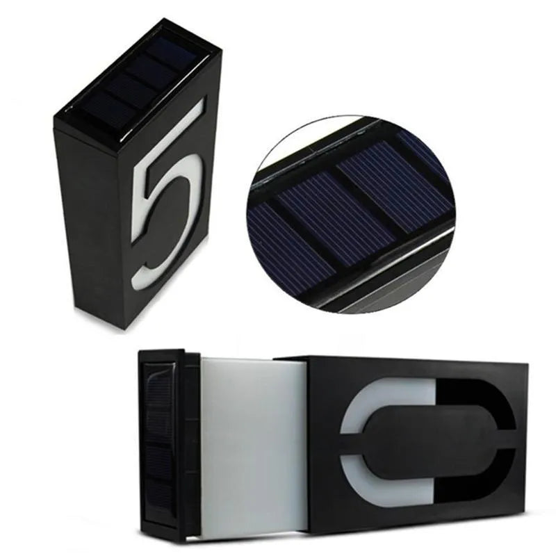Solar powered house number light with white LEDs illuminating digit, IP65 waterproof outdoor design