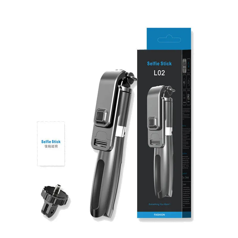 Black and white adjustable Bluetooth selfie stick tripod with wireless remote control extended next to smartphone.