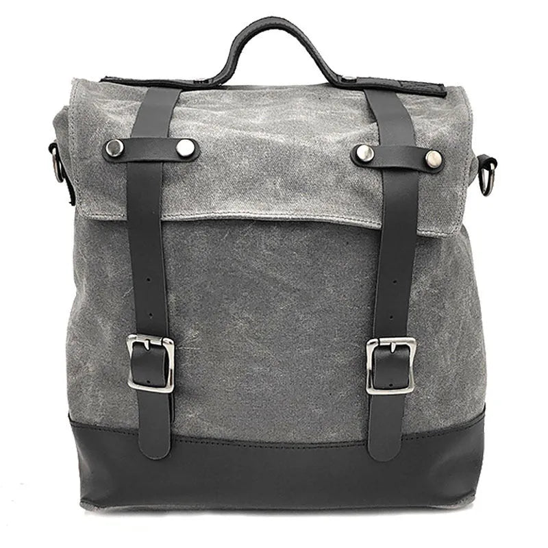 Large black waterproof canvas motorcycle side bag with cowhide top layer mounted on motorcycle