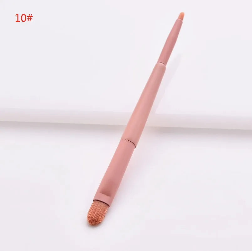 Ten makeup brushes with wooden handles arranged showing different brush head types including powder, foundation and double-headed tools