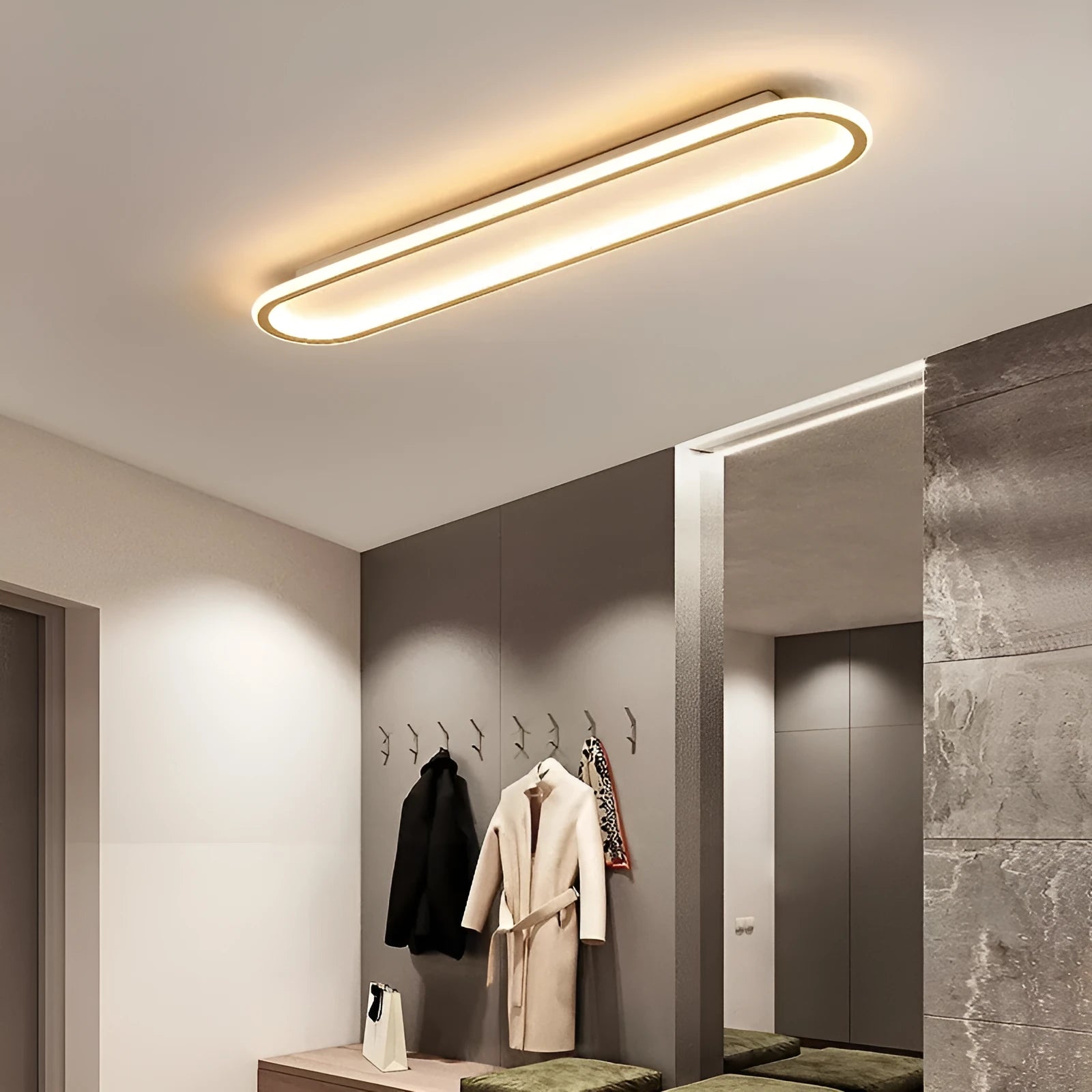 Black aluminium strip ceiling lamp with PVC shade in 60cm length mounted on a white ceiling.