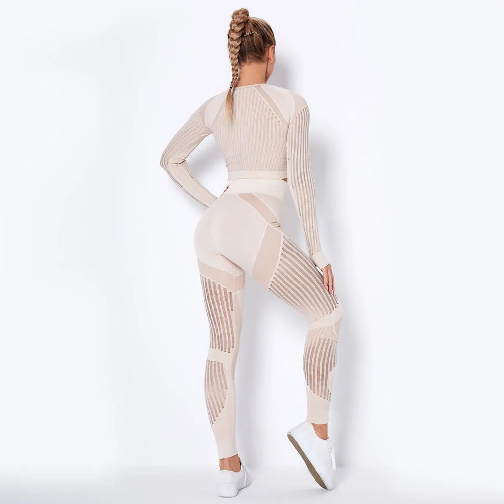 Women's long-sleeved seamless knitted yoga suit in a neutral colour, showing the stretch fabric and close fit.