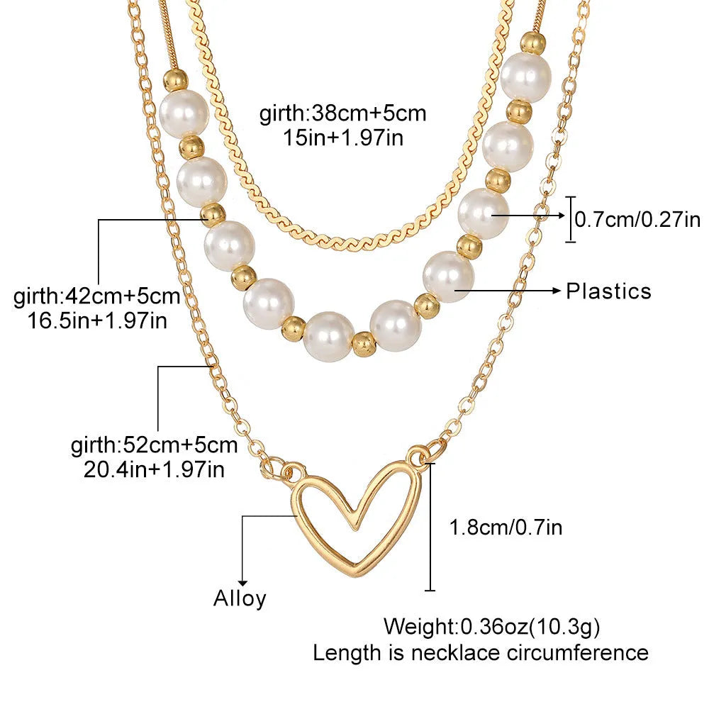 Vintage gold-tone heart pendant necklace with pearl chain and adjustable length