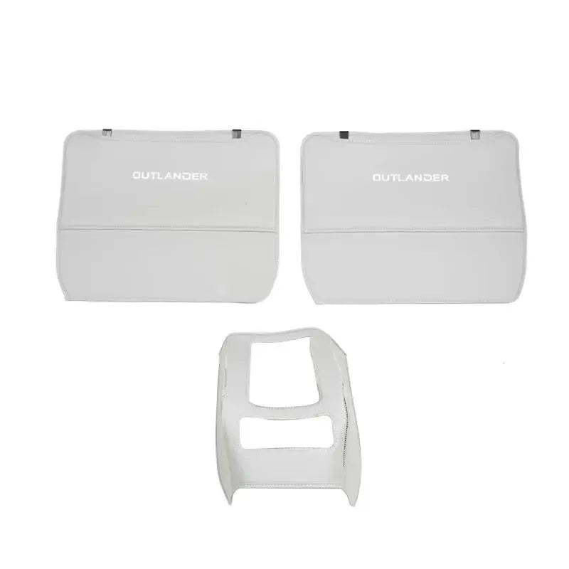 Set of three leather anti-kick pads for Mitsubishi Outlander seats and console in black, grey, and brown.