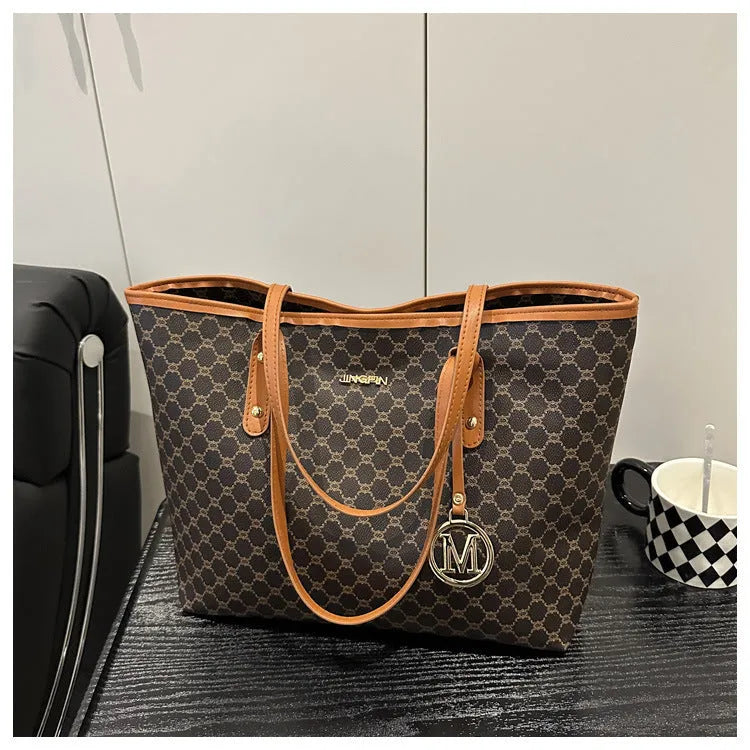 Street trend western style shoulder bag in PU material with sewn detailing, shown in black.