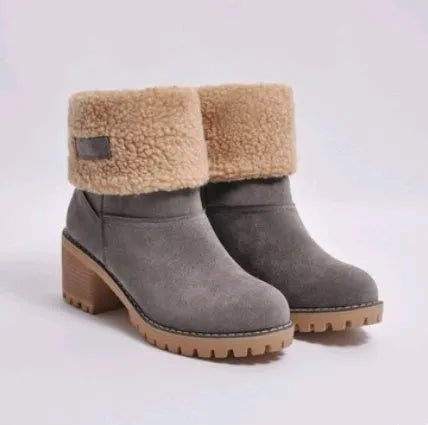 Women's mid-tube suede snow boot in black with a thick heel and round toe.
