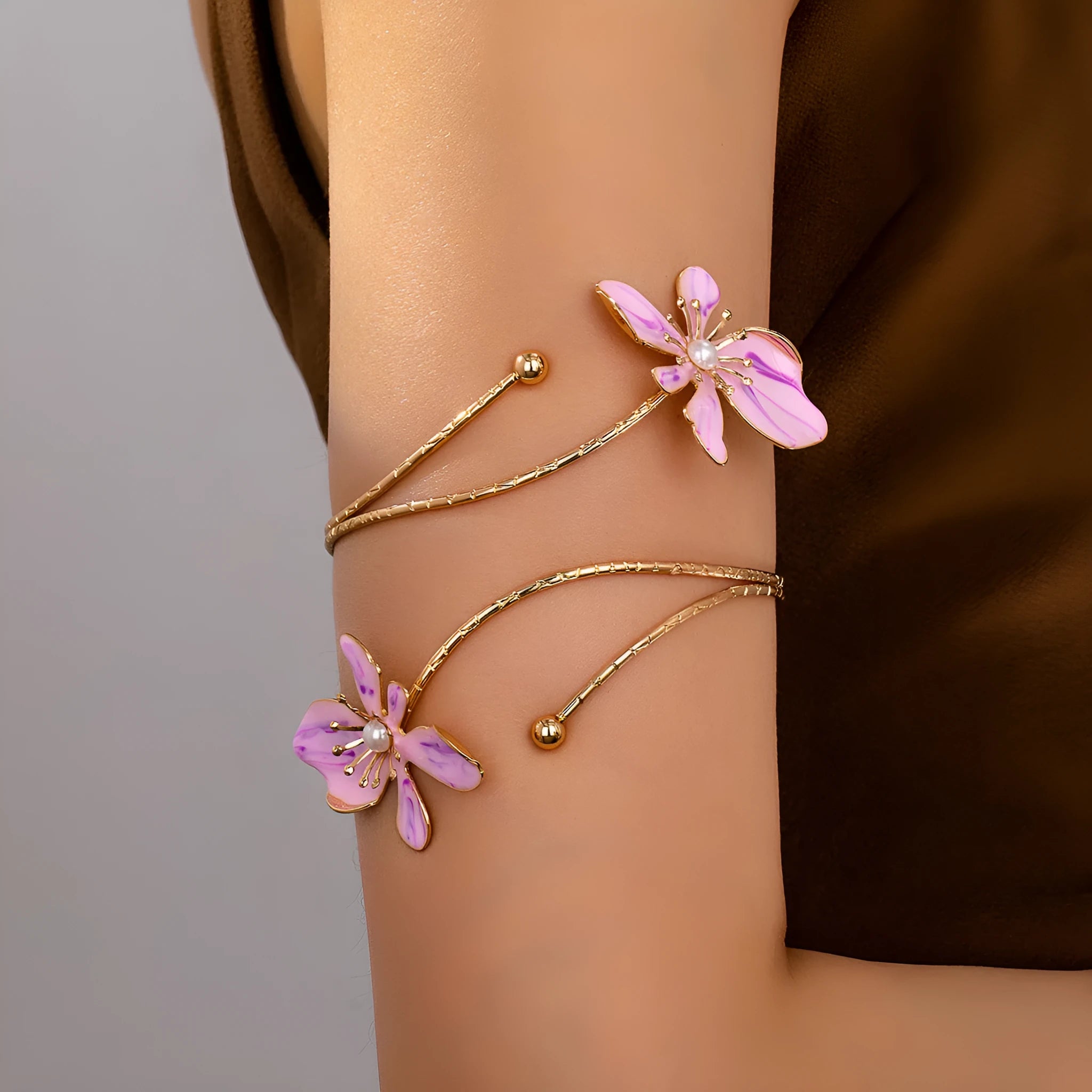 Personalised hollow pattern alloy armband in pink or purple colour on wrist