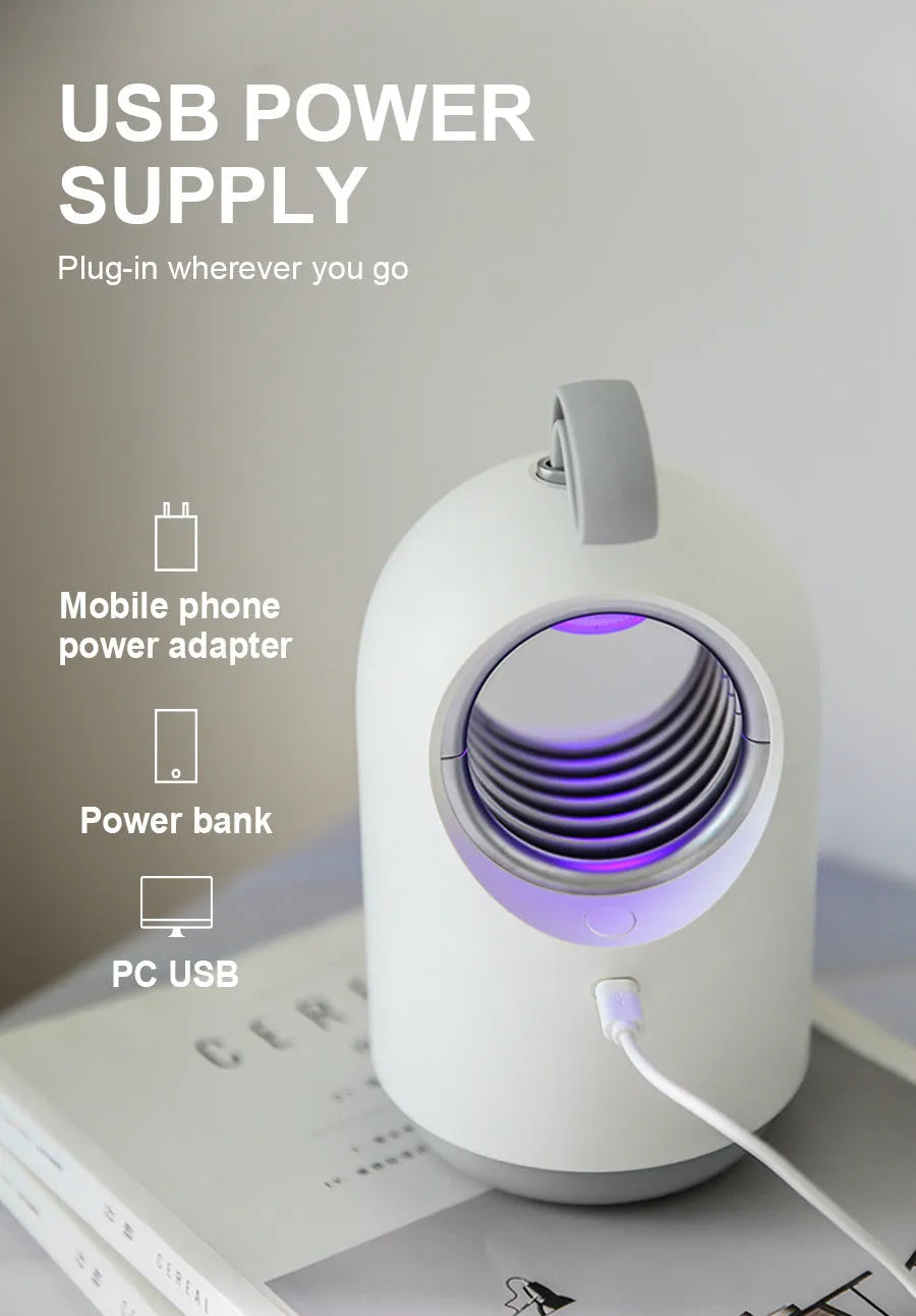 Blue and white indoor mosquito killer lamp with UV light, USB port, and silicone carry handle.