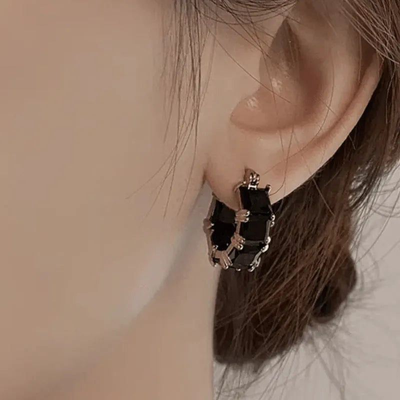 Geometric U-shaped zirconium earrings with round detailing in black, pink or white options