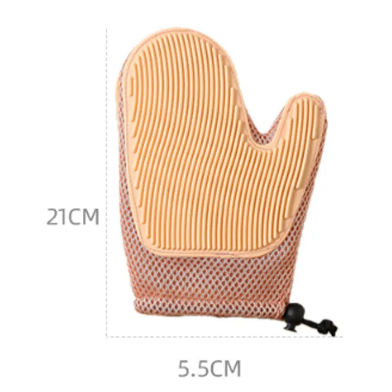 Right hand pet grooming glove in blue on fabric, showing mesh texture for removing cat and dog hair.