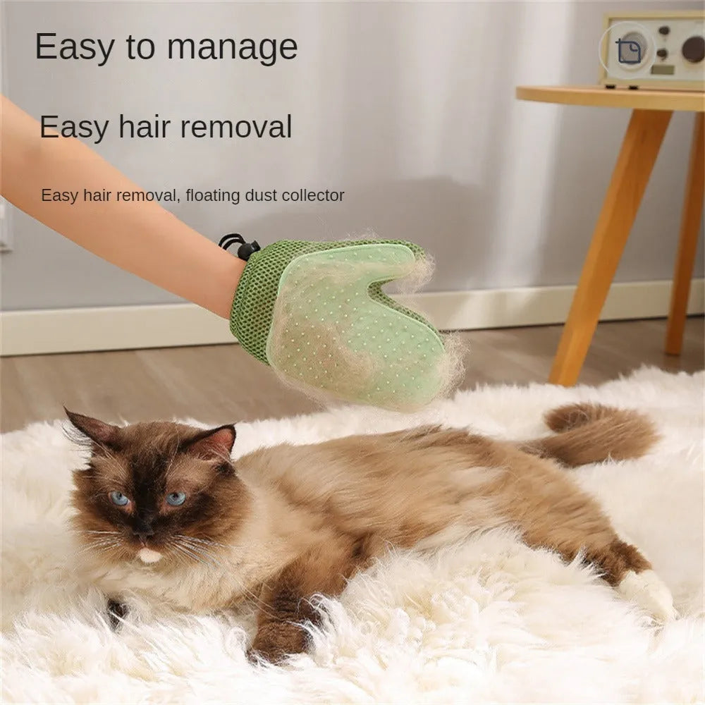 Right hand pet grooming glove in blue on fabric, showing mesh texture for removing cat and dog hair.