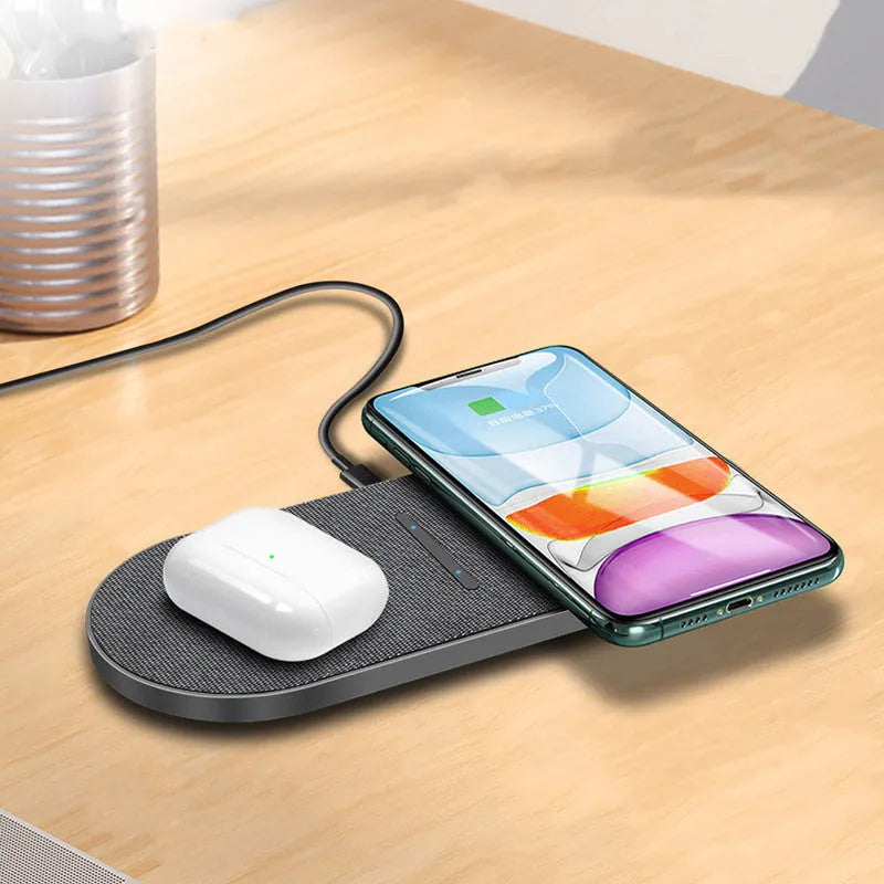 Black dual-pad 10W wireless fast charger for mobile phones with LED lights.