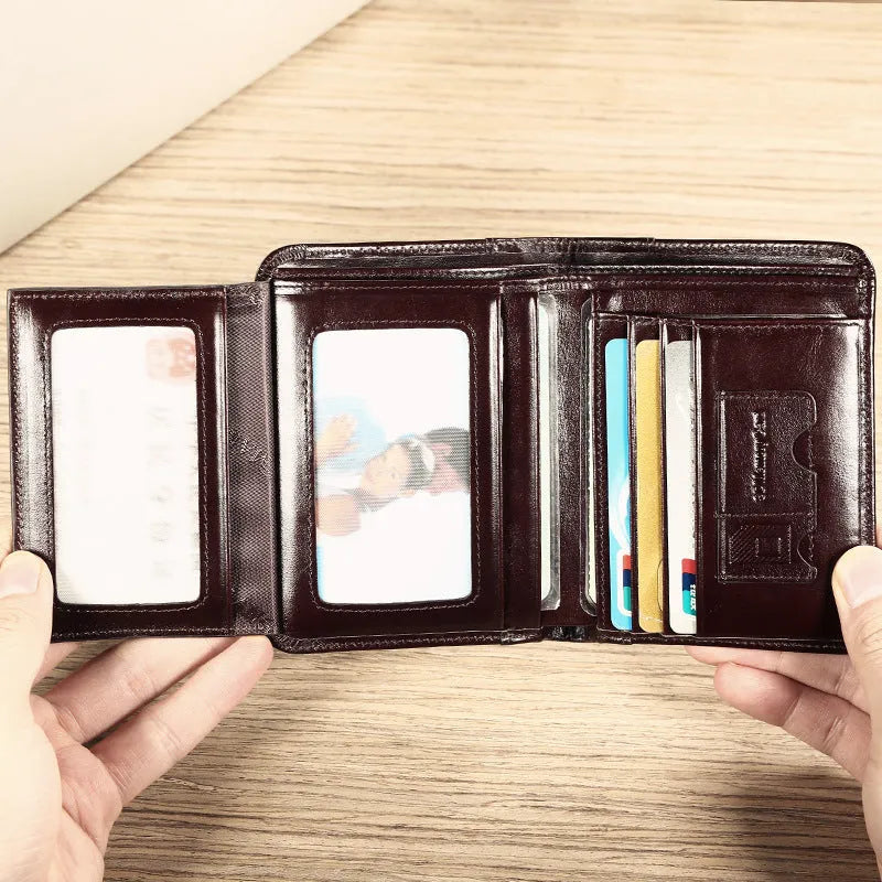 Men's genuine leather wallet open showing multiple internal compartments including card slots and secret pocket