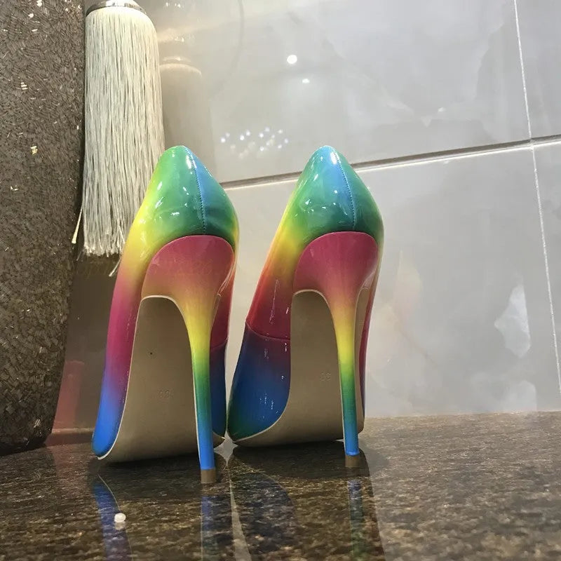 Rainbow glossy patent leather women's stiletto heels with a pointed toe and thin high heel.