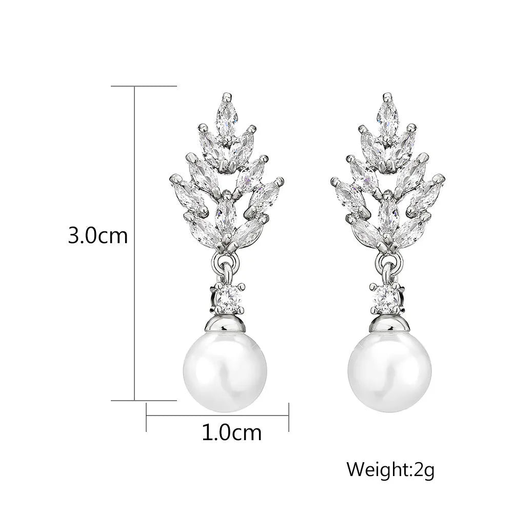 Geometric shaped floral earrings with micro zircon inlays, shown in a gold-tone plated finish.