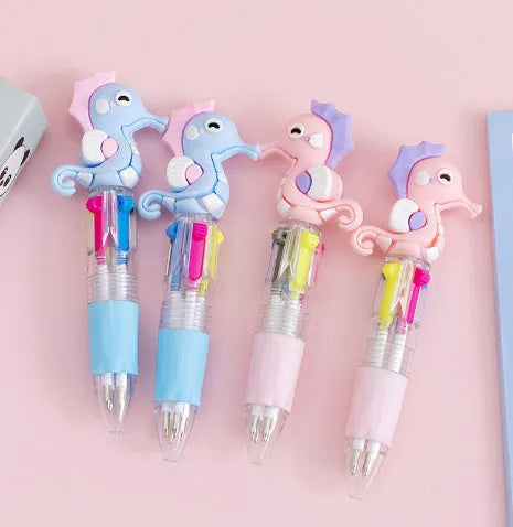 Cartoon print press ballpoint pen showing four-colour design options including cactus, fast food, and heart wings.