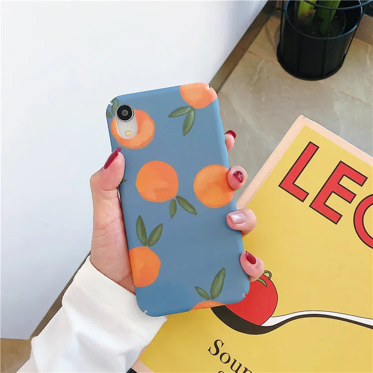 Orange retro plastic iPhone case with water and blue background design shown on smartphone