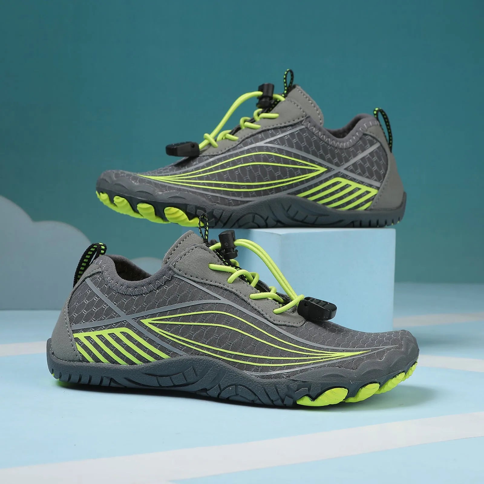 Children's black quick-drying water shoes with a non-slip rubber sole and elastic band.