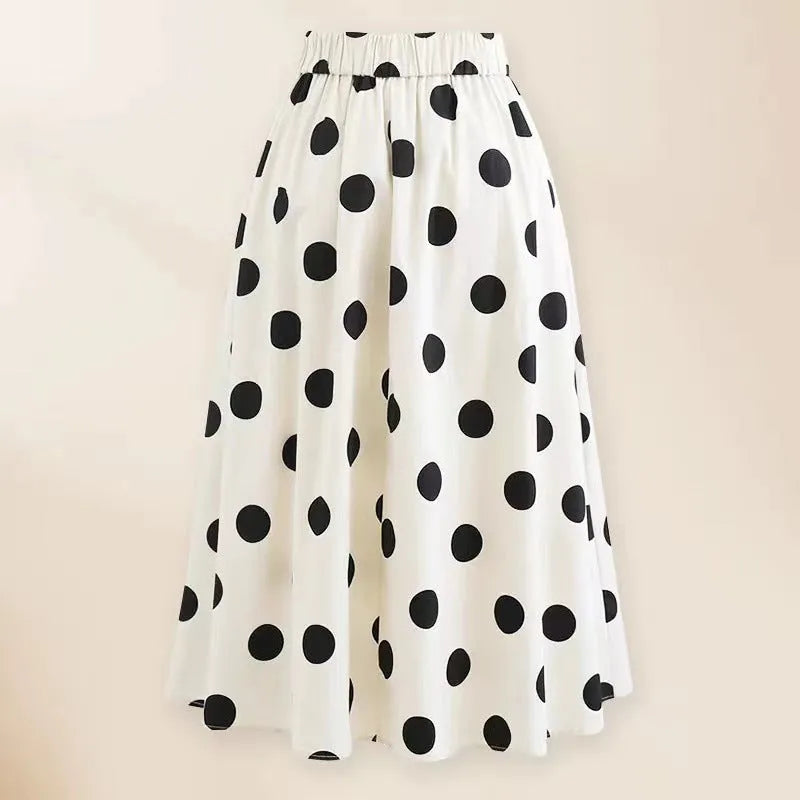 Women's black one-piece swimsuit with white attached skirt beach dress and bow trim