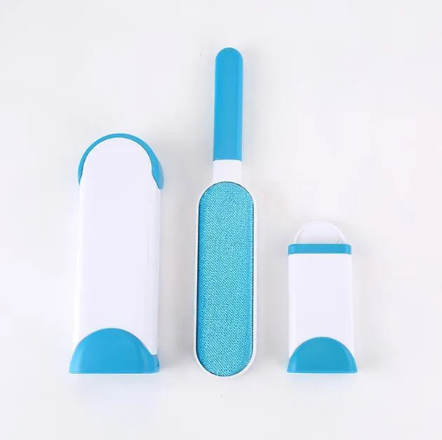 Blue reusable pet hair removal brush with a self-cleaning base, placed on a grey sofa.