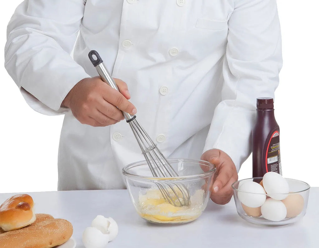 White 500W 5-speed electric hand mixer with beaters and dough hooks on a kitchen counter