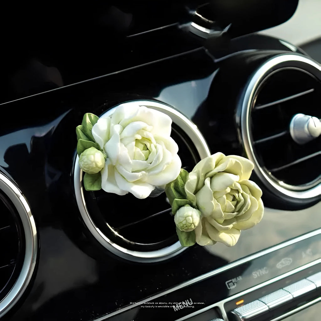 Solid jasmine car perfume for air vent with gypsum base and essential oil bottle in beige white or green.