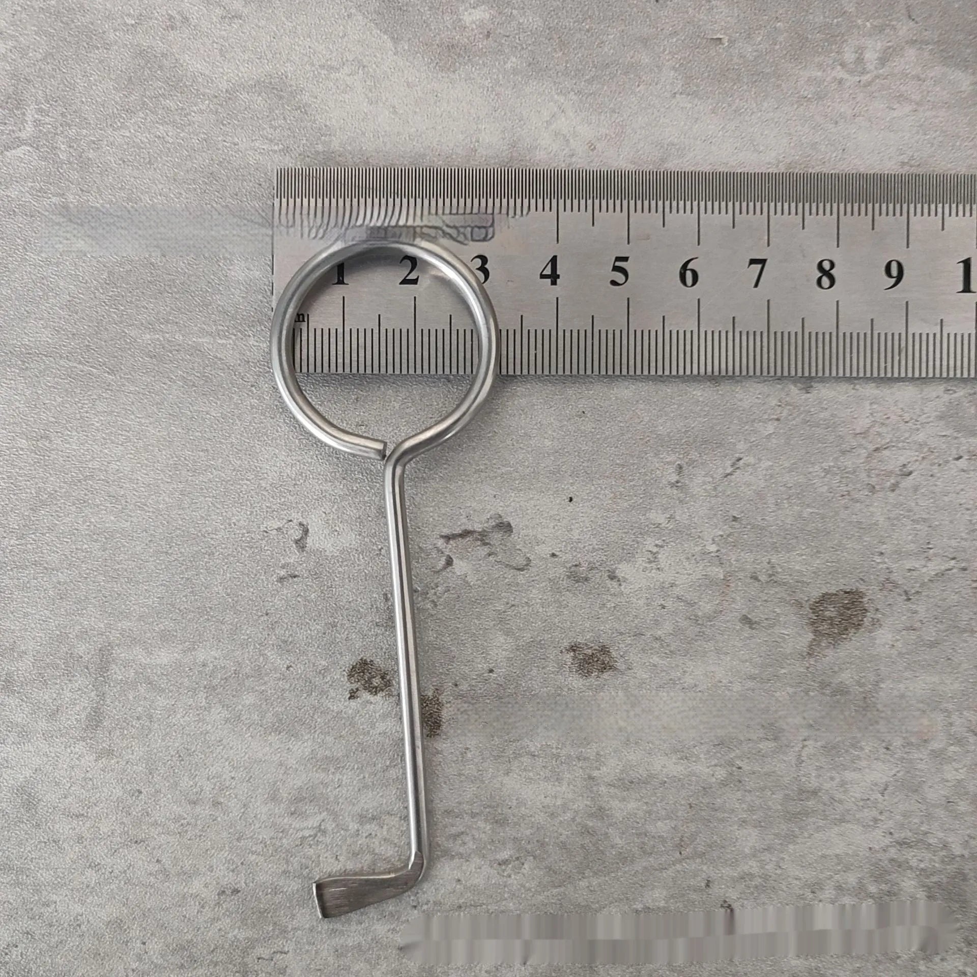 Two identical silver alloy steel wrench tools from a portable household repair set.
